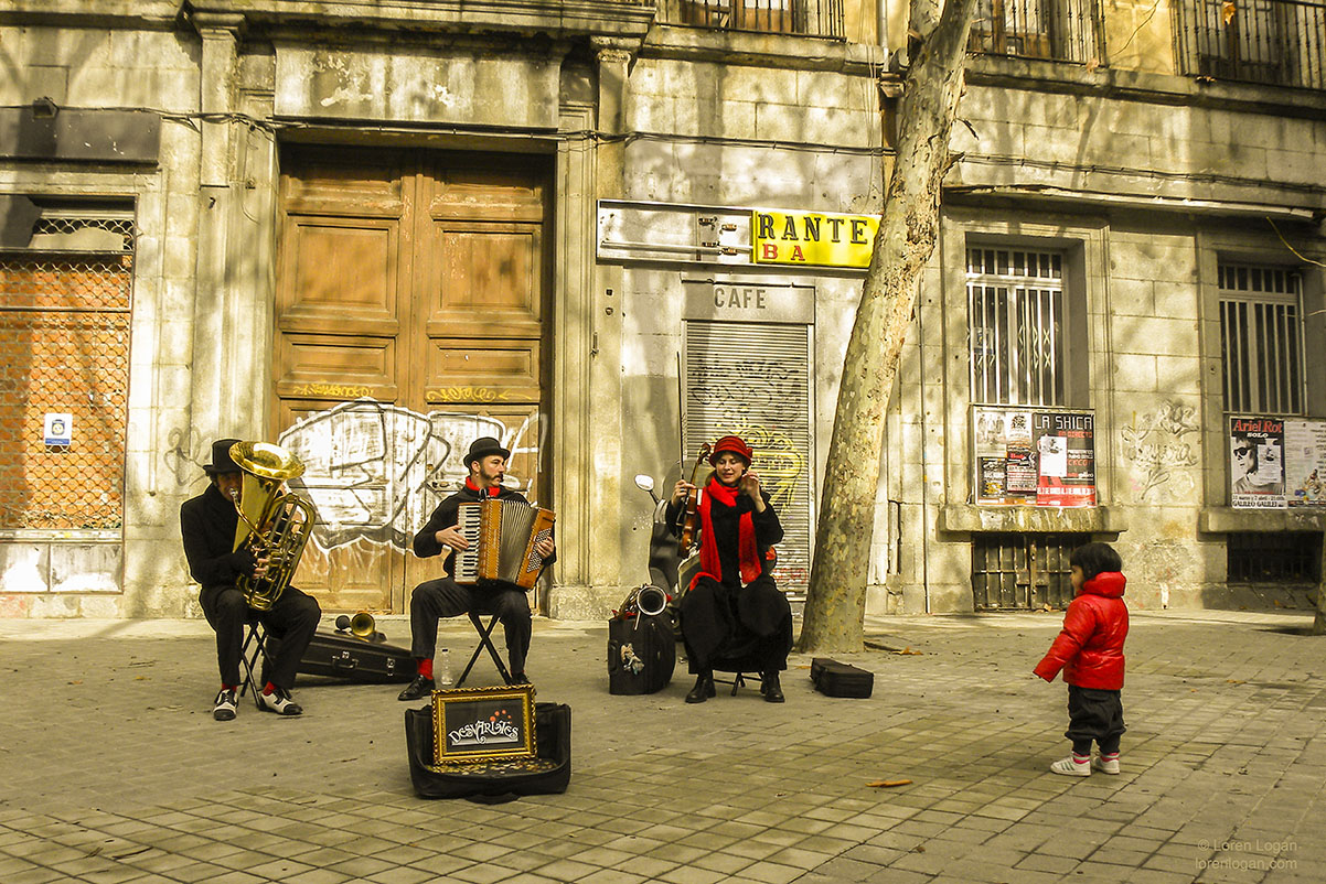 Wandering the streets of Madrid, I found this child caught up in the joyful music&nbsp;this trio produced. Still&nbsp;as a dove...